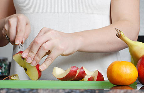 Feel Well - Woman Cutting Apples